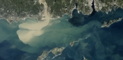 Image of Silt and sediment emptying into the long island sound from a river mouth
